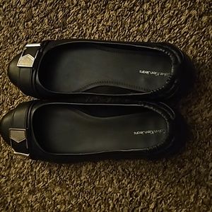 Women's black flats with silver buckle. Calvin Klein jeans brand